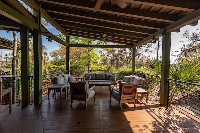deck featuring outdoor lounge area and ceiling fan