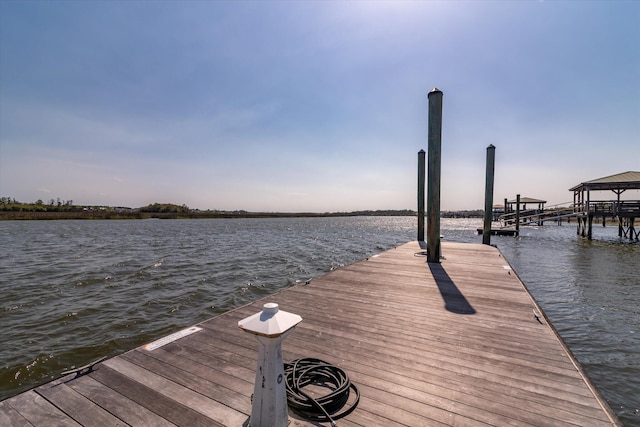 dock area featuring a water view