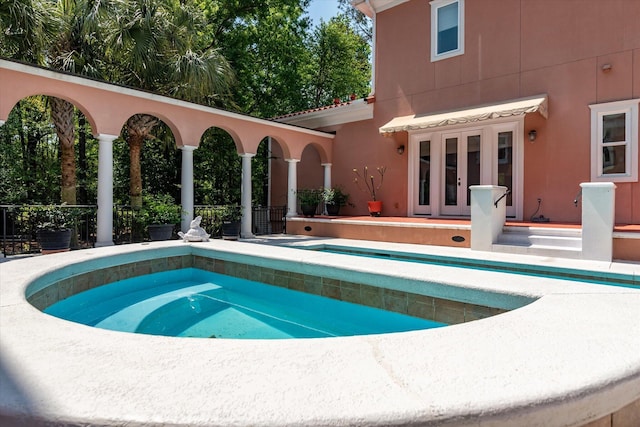 view of pool featuring a pool, french doors, and a patio area