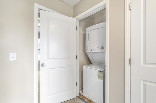 laundry area featuring stacked washer and dryer