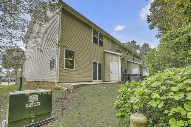 back of property with central AC unit