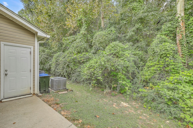 view of yard with central air condition unit