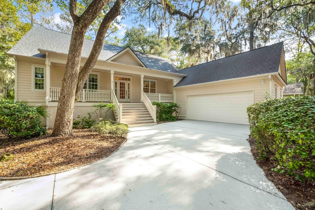 view of front facade with a garage and a porch