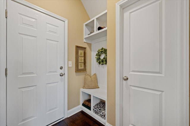 mudroom featuring dark wood finished floors and baseboards