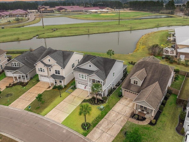 aerial view with a water view and a residential view