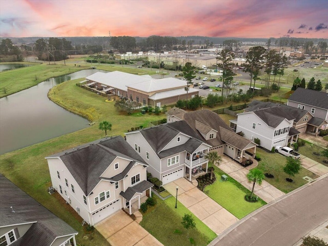 bird's eye view with a water view and a residential view