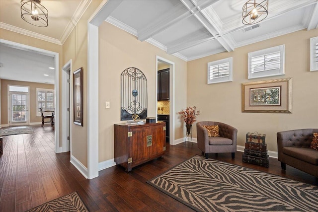 living area featuring dark wood-style floors, baseboards, coffered ceiling, and crown molding