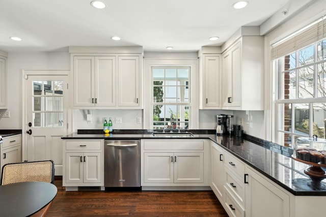 kitchen featuring dark wood-type flooring, dishwasher, recessed lighting, white cabinets, and a sink