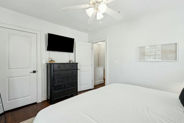 bedroom featuring a ceiling fan and dark wood-style flooring