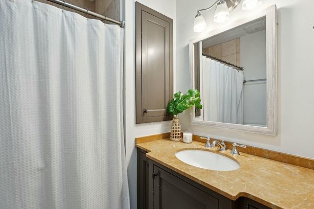 full bath with a shower with curtain and vanity