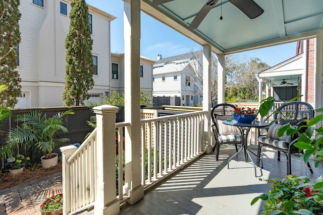 deck featuring outdoor dining space and a ceiling fan