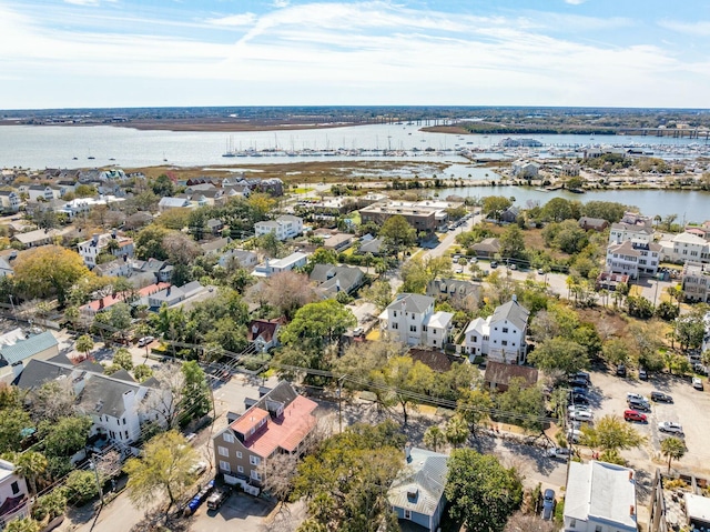 drone / aerial view with a residential view and a water view