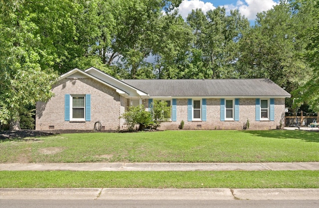 single story home featuring crawl space, brick siding, and a front lawn