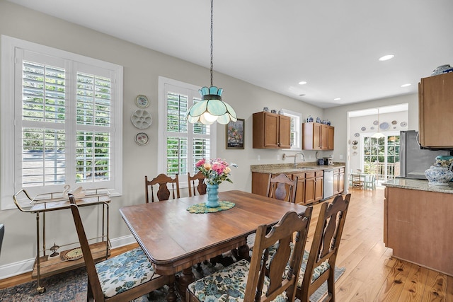 dining area with recessed lighting, baseboards, and light wood finished floors
