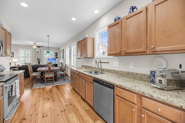 kitchen featuring ceiling fan, recessed lighting, a sink, light wood finished floors, and stainless steel appliances