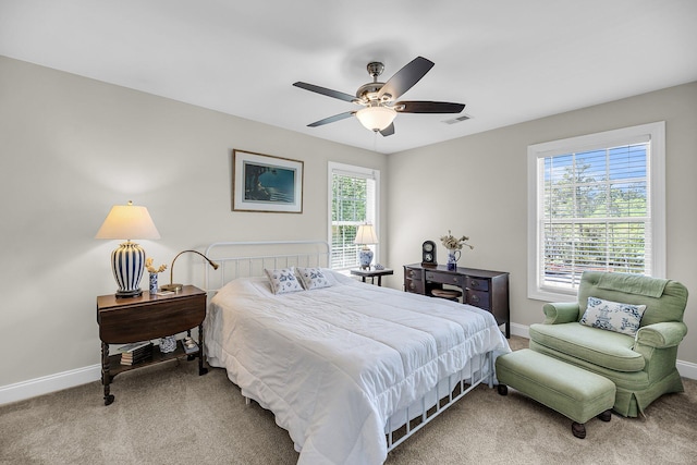 bedroom featuring baseboards, ceiling fan, carpet, and visible vents