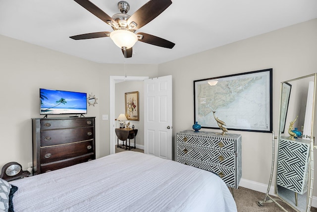 bedroom with baseboards, a ceiling fan, and carpet flooring