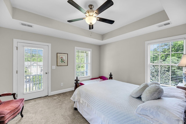 bedroom featuring multiple windows and visible vents