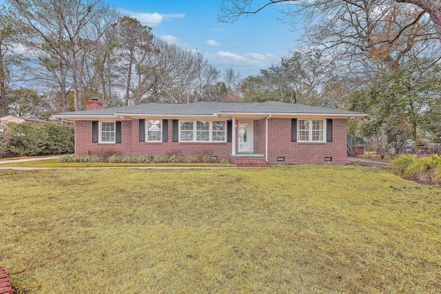 single story home with crawl space, brick siding, a chimney, and a front yard