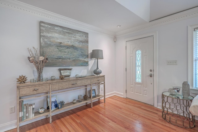 entryway featuring baseboards and wood finished floors