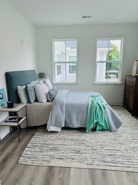 bedroom with hardwood / wood-style flooring