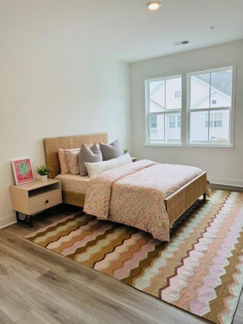 bedroom featuring wood-type flooring