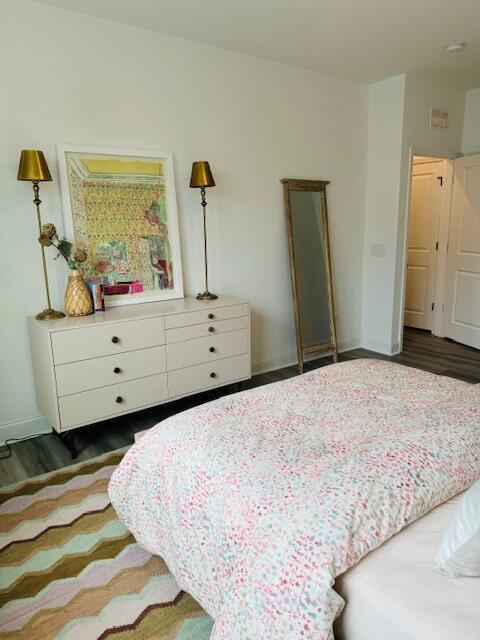 bedroom featuring dark wood-type flooring