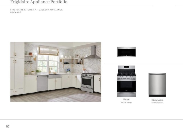 kitchen with white cabinetry, stainless steel appliances, wall chimney exhaust hood, sink, and decorative backsplash