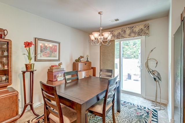 dining space with an inviting chandelier