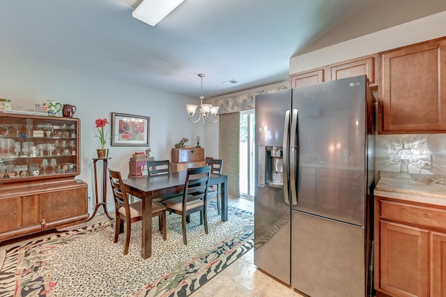 dining space with a notable chandelier