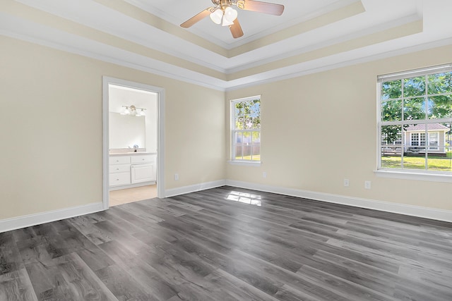 7869 High Maple Cir N, Charleston, SC 29418 - empty room featuring a tray ceiling, crown molding, dark wood-style flooring, a ceiling fan, and baseboards