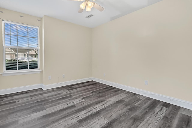 7869 High Maple Cir N, Charleston, SC 29418 - spare room with dark wood finished floors, a ceiling fan, and baseboards