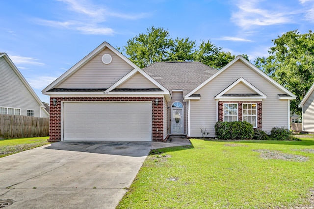 7869 High Maple Cir N, Charleston, SC 29418 - traditional home featuring brick siding, concrete driveway, an attached garage, and a shingled roof