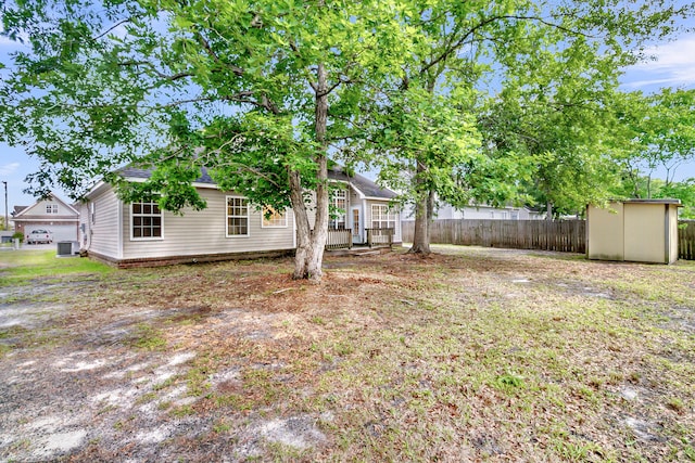 7869 High Maple Cir N, Charleston, SC 29418 - view of yard with a storage unit, fence, an outbuilding, and central AC