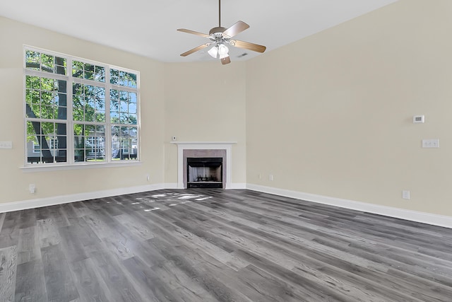 7869 High Maple Cir N, Charleston, SC 29418 - unfurnished living room with wood finished floors, a ceiling fan, a fireplace with flush hearth, and baseboards