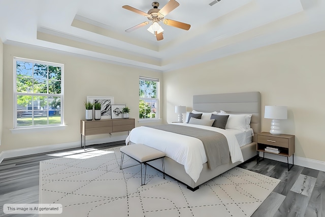 7869 High Maple Cir N, Charleston, SC 29418 - bedroom featuring a raised ceiling, baseboards, wood finished floors, and ceiling fan