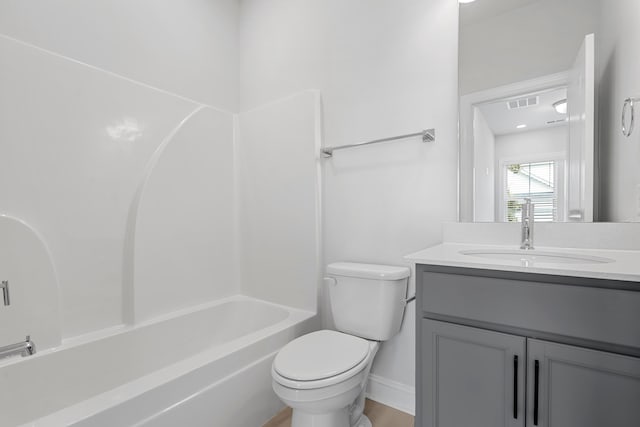 full bathroom featuring bathtub / shower combination, vanity, and toilet