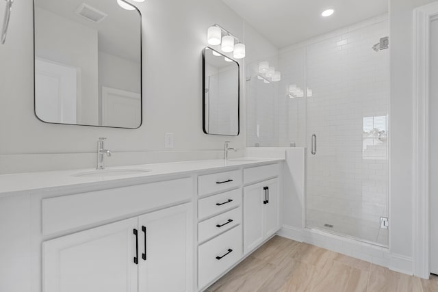 bathroom featuring vanity and walk in shower