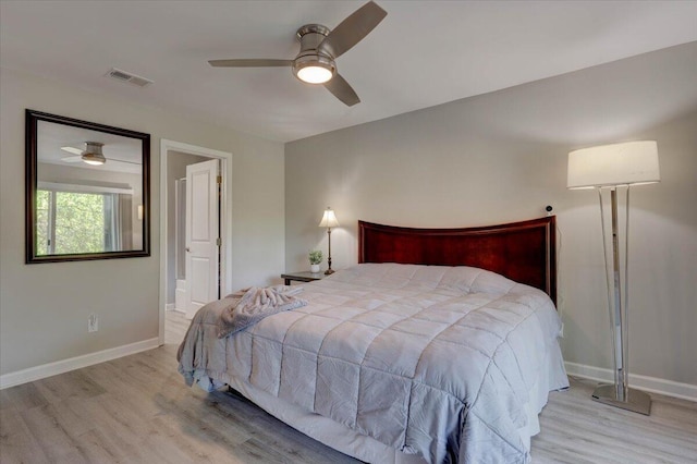 8483 Yadkin Cir Unit D, North Charleston, SC 29406 - bedroom with wood finished floors, connected bathroom, and ceiling fan