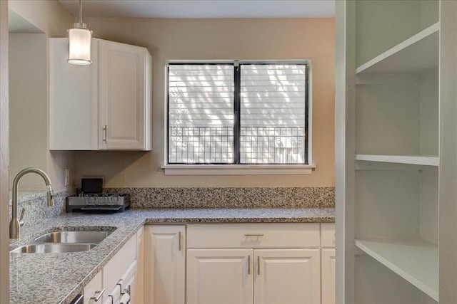8483 Yadkin Cir Unit D, North Charleston, SC 29406 - kitchen with white cabinets, pendant lighting, and light stone counters