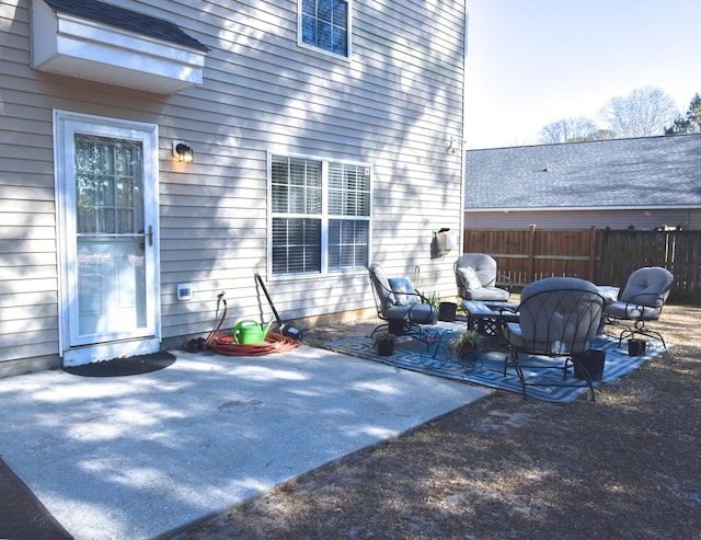 view of patio featuring fence