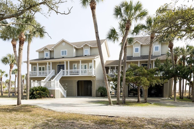 coastal home featuring a carport and a porch