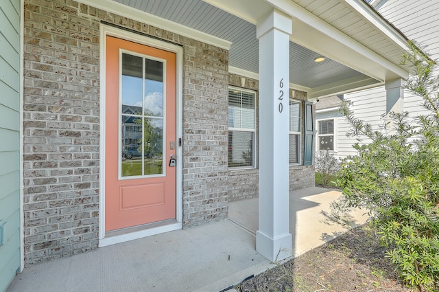 doorway to property with a porch