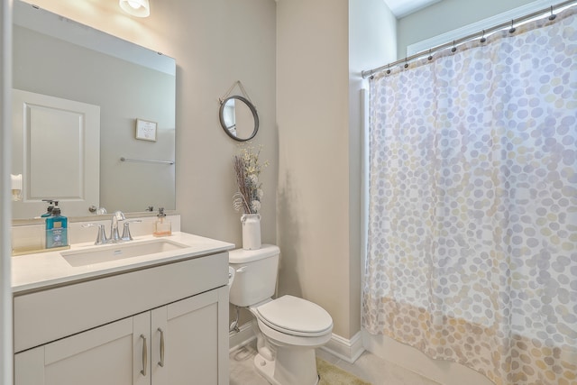 bathroom featuring a shower with curtain, vanity, toilet, and tile patterned floors