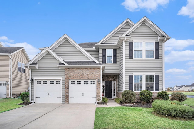 view of front of home featuring a front lawn and a garage