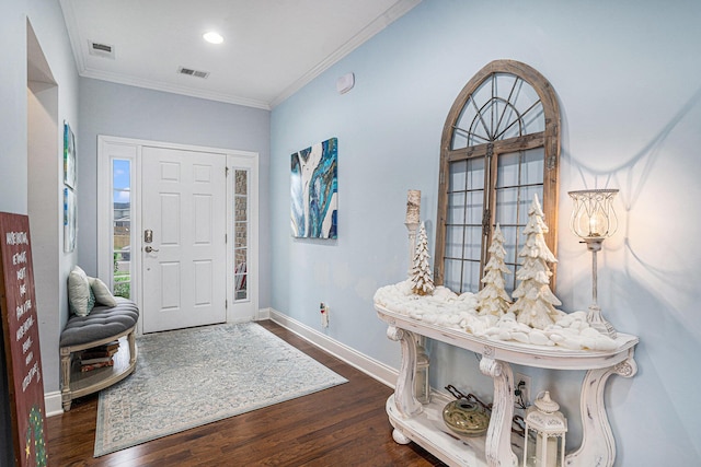 foyer featuring dark hardwood / wood-style floors and ornamental molding