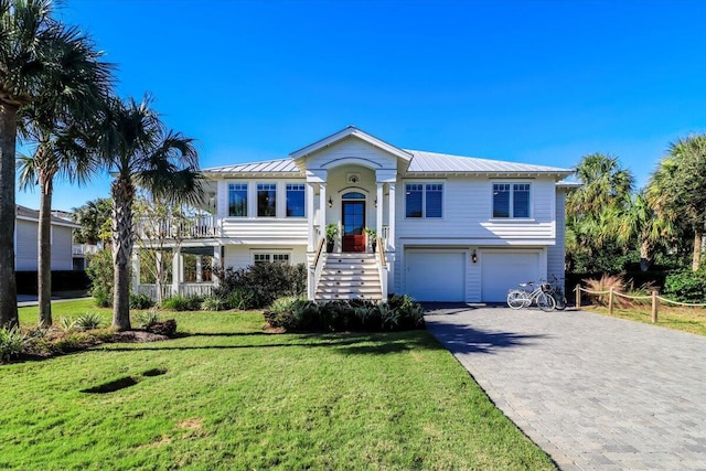 bi-level home with a front yard and a garage