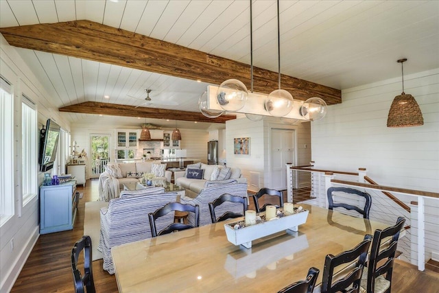 dining space with ceiling fan, lofted ceiling with beams, and dark hardwood / wood-style flooring