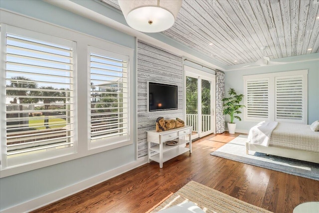 interior space featuring wood ceiling, multiple windows, and hardwood / wood-style floors