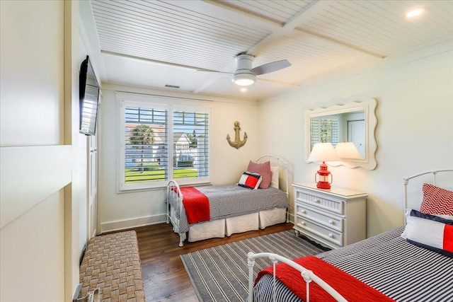 bedroom featuring ceiling fan and dark wood-type flooring